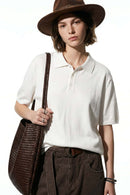 Relaxed Cotton Knit Polo Shirt in White - front modeled view
