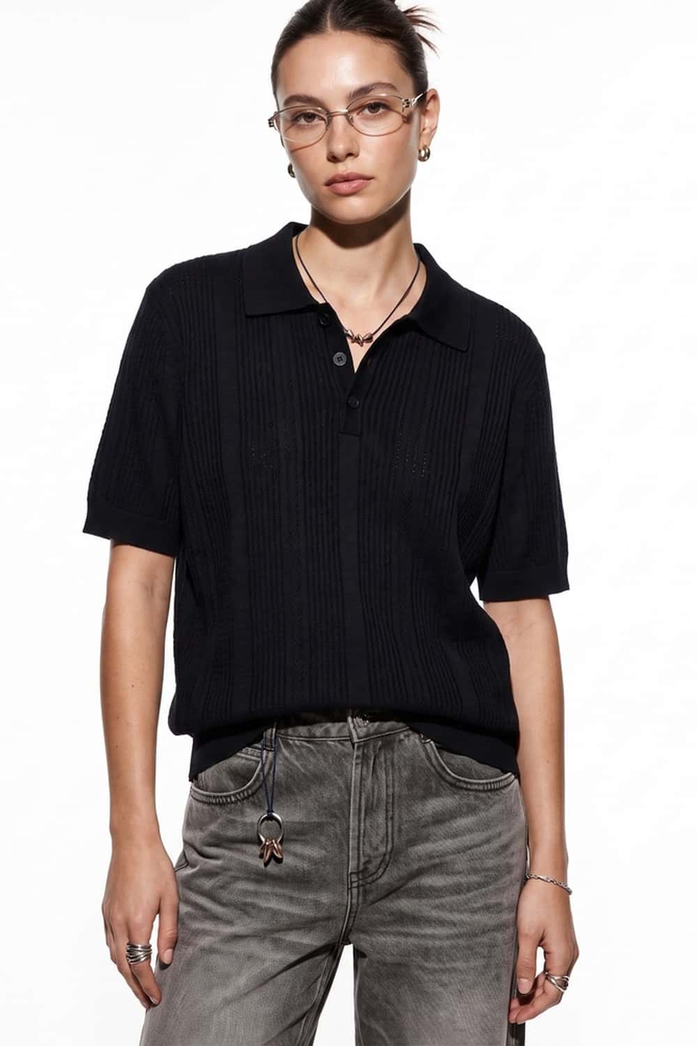 Short-Sleeve Knit Polo with Vertical Texture in Black - front modeled close-up