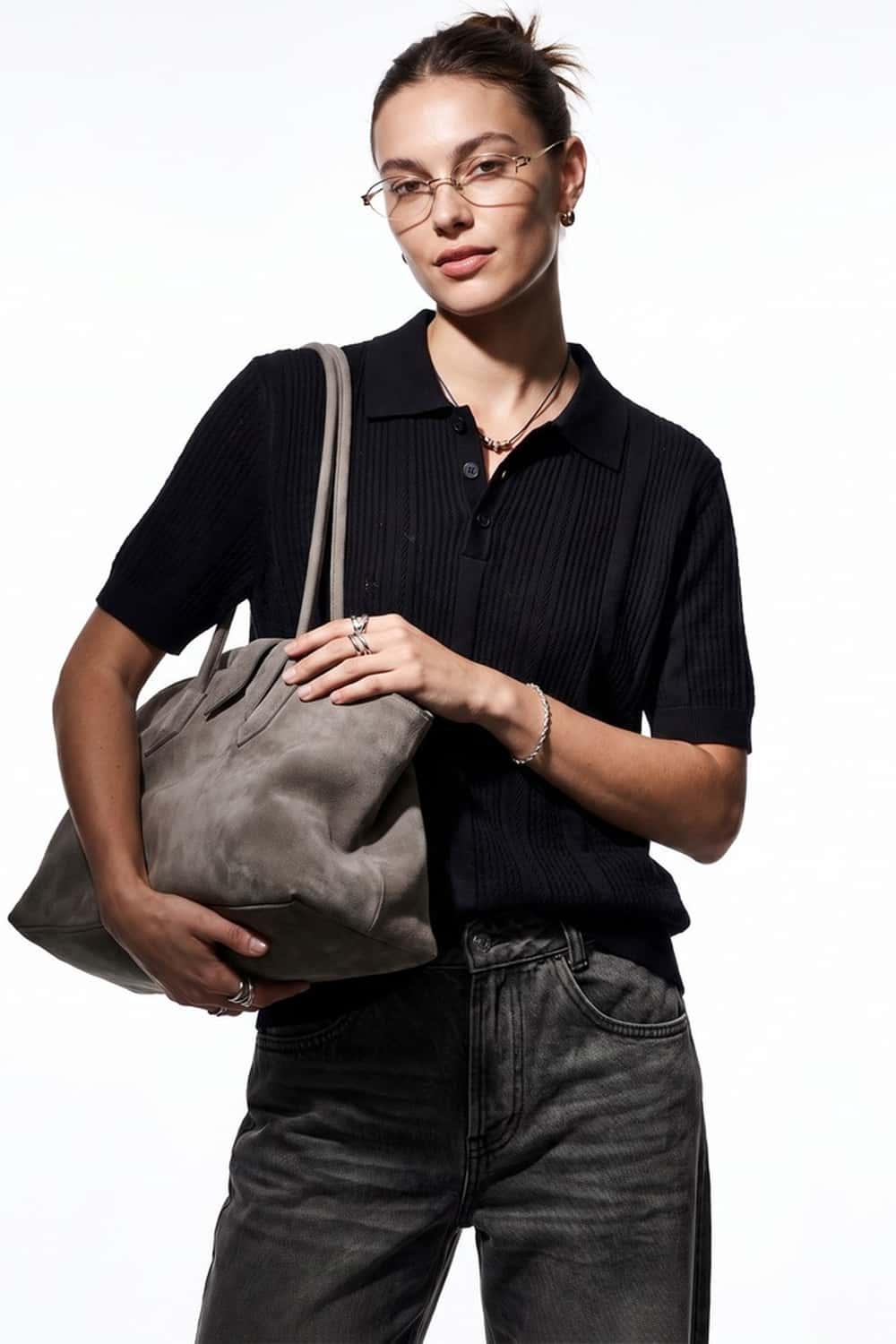 Short-Sleeve Knit Polo with Vertical Texture in Black - front modeled close-up