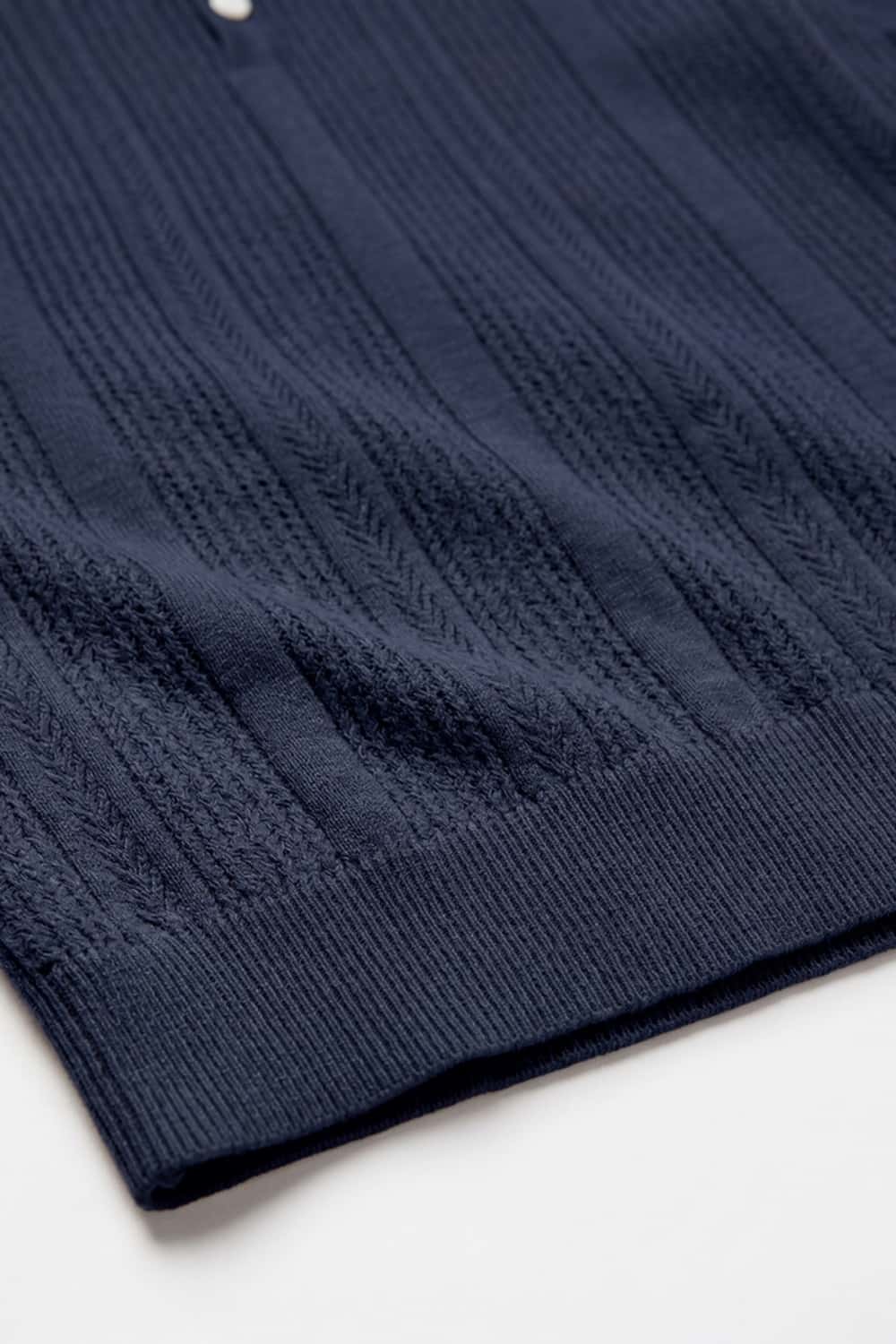 Short-Sleeve Knit Polo with Vertical Texture in Navy Blue - hem detail