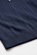 Short-Sleeve Knit Polo with Vertical Texture in Navy Blue - hem detail