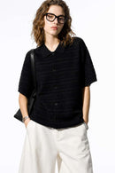 Short-Sleeve Knit Cardigan with Openwork Bands in Black - full-length front modeled view