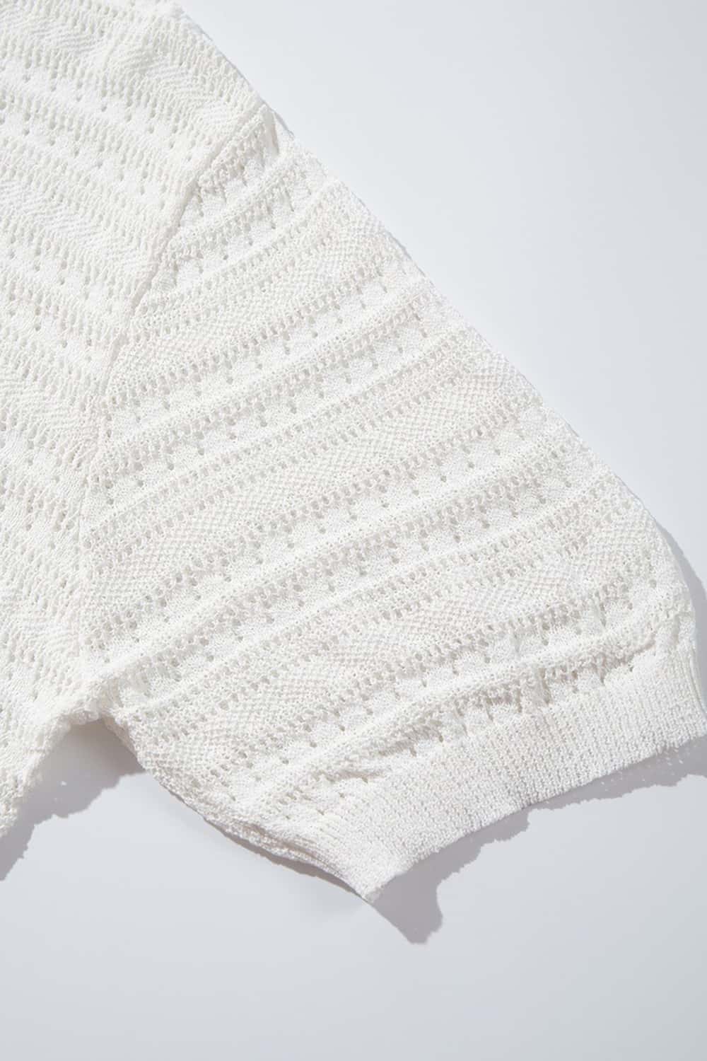 Short-Sleeve Knit Cardigan with Openwork Bands in White - fabric texture close-up