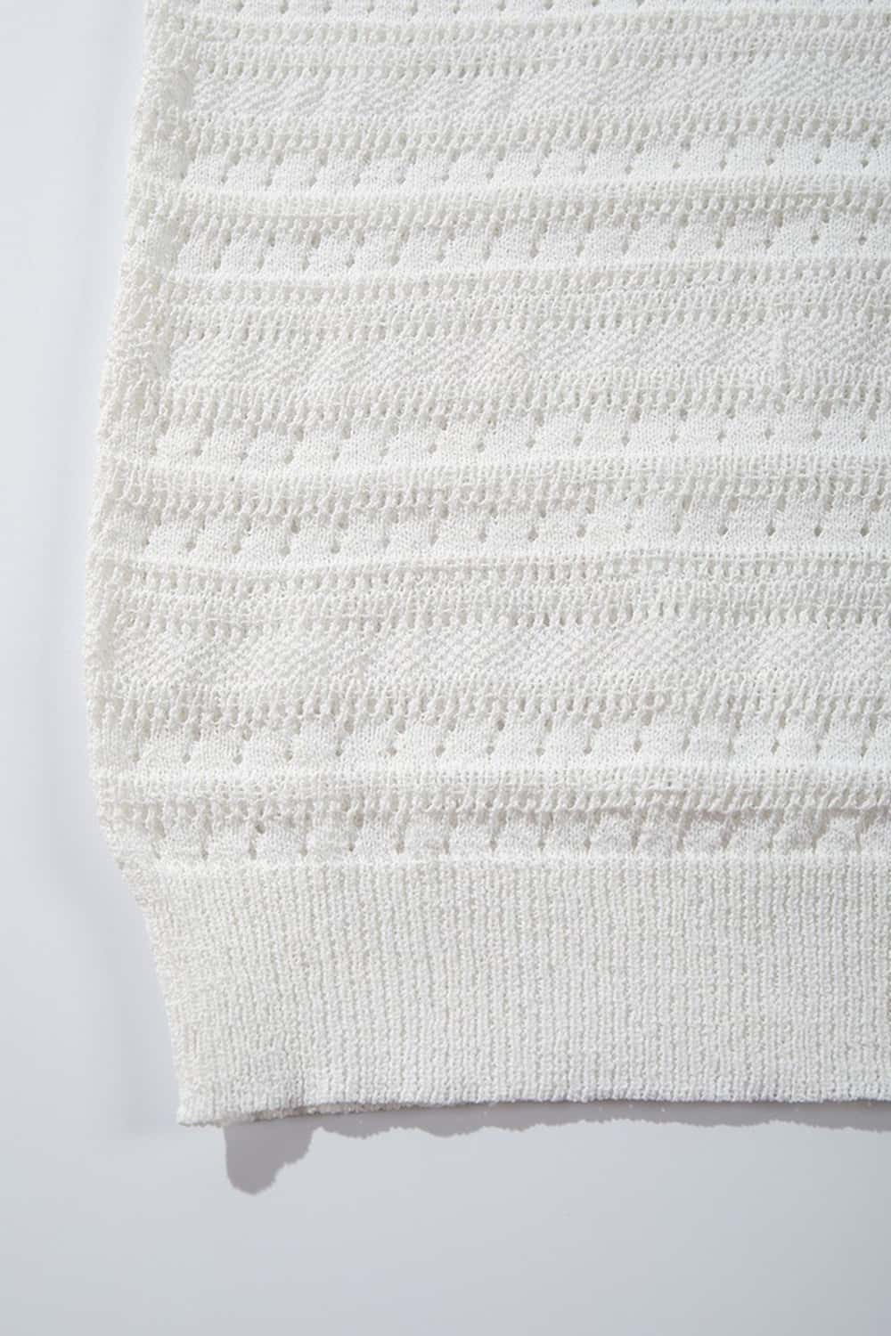 Short-Sleeve Knit Cardigan with Openwork Bands in White - fabric texture close-up