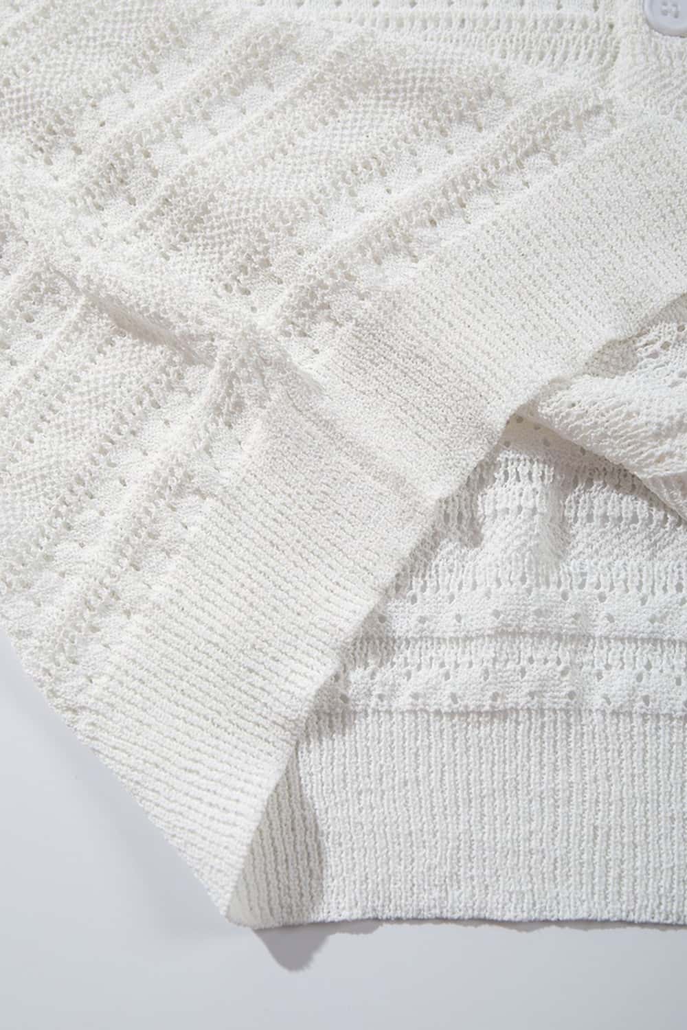Short-Sleeve Knit Cardigan with Openwork Bands in White - fabric texture close-up