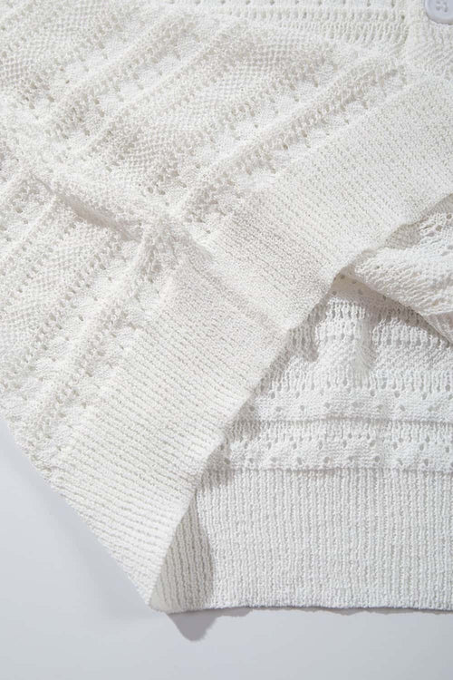 Short-Sleeve Knit Cardigan with Openwork Bands in White - fabric texture close-up