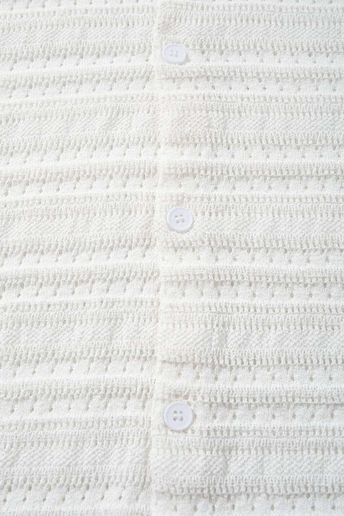 Short-Sleeve Knit Cardigan with Openwork Bands in White - fabric texture close-up