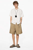 Short-Sleeve Knit Cardigan with Openwork Bands in White - full-length front modeled view