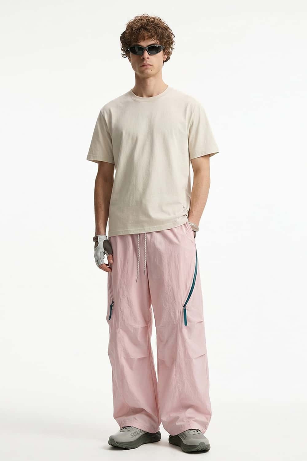 Waterproof Wide-Leg Pants with Drawstring Waist in Light Pink - front modeled view
