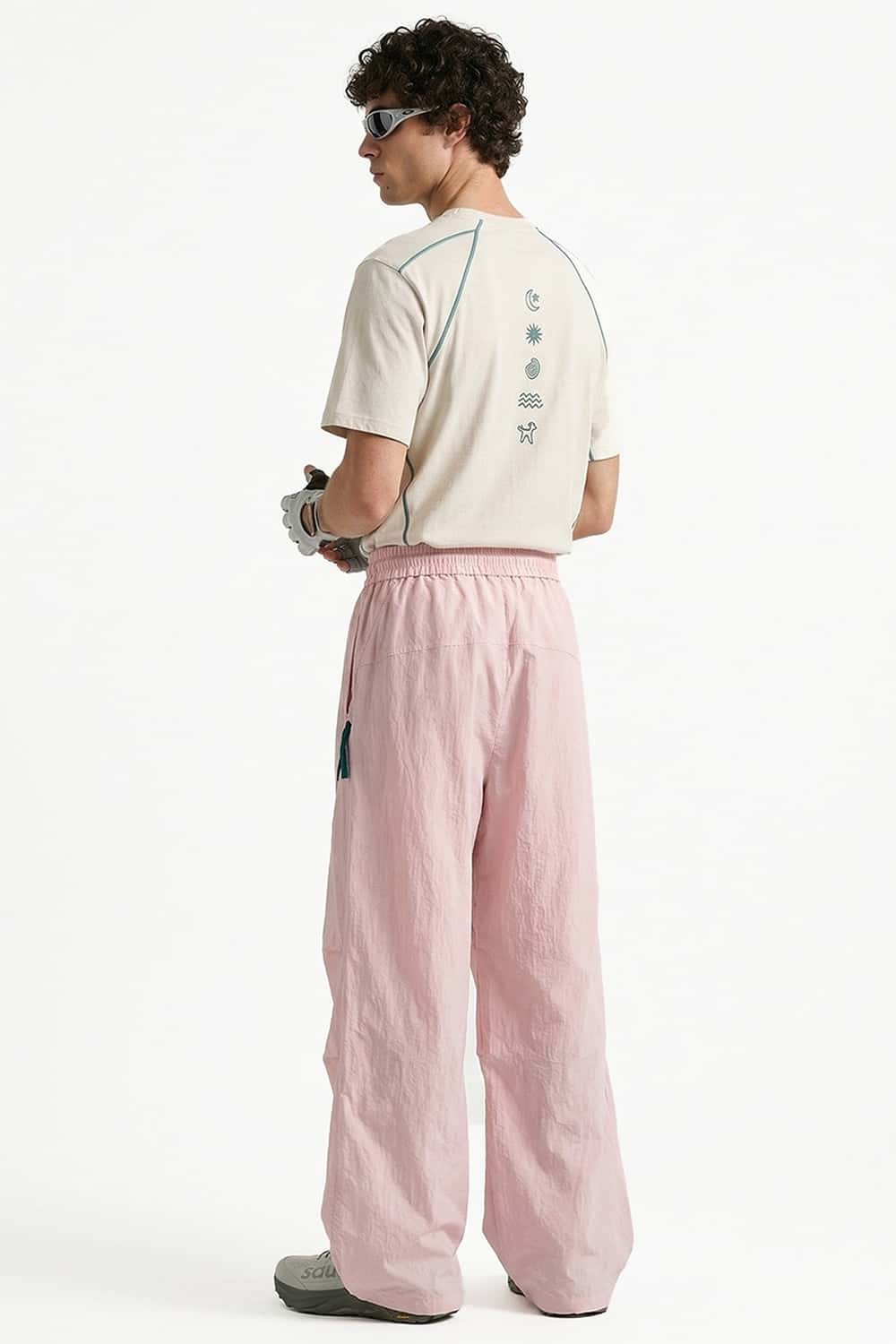 Waterproof Wide-Leg Pants with Drawstring Waist in Light Pink - back modeled view