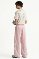 Waterproof Wide-Leg Pants with Drawstring Waist in Light Pink - back modeled view