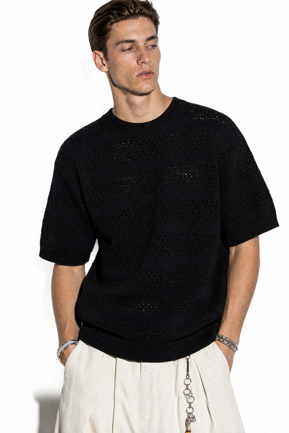 Breathable Short-Sleeve Knit Top with Openwork Bands in Black - full-length front modeled view