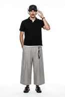 Short-Sleeve Polo Shirt with Layered Details in Active Black - full-length front modeled view