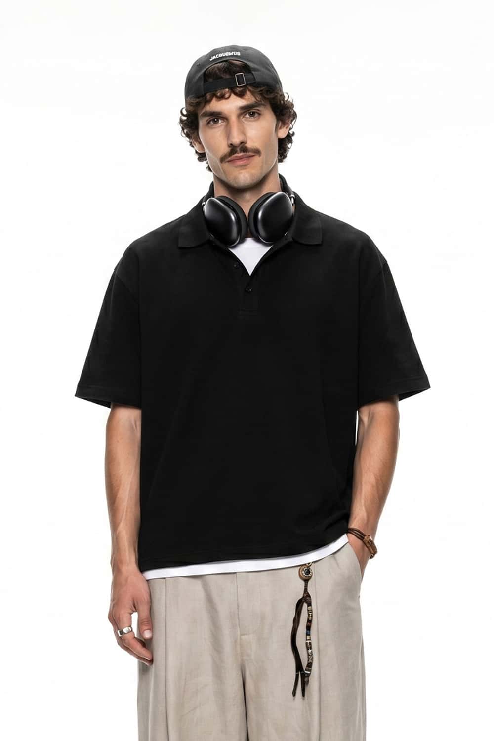 Short-Sleeve Polo Shirt with Layered Details in Active Black - front modeled close-up