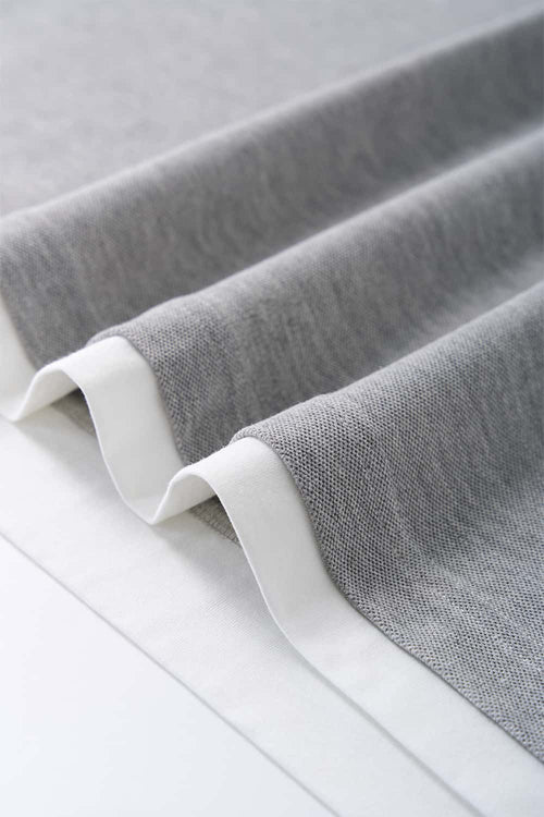 Short-Sleeve Polo Shirt with Layered Details in Flower Gray - hem detail