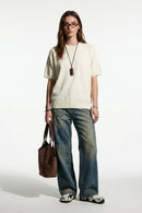 Short-Sleeve Knit Top with Dropped Shoulders in Beige - full-length front modeled view