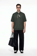Short-Sleeve Knit Top with Dropped Shoulders in Military Green - full-length front modeled view