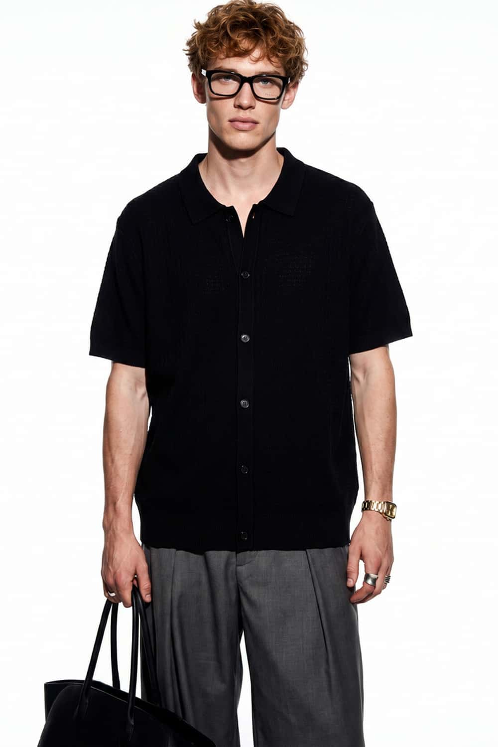 Textured Short-Sleeve Knit Shirt in Black - full-length front modeled view