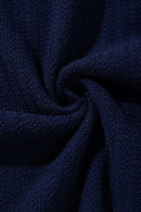Textured Short-Sleeve Knit Shirt in Navy Blue - fabric texture close-up