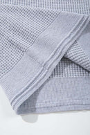 Open-Neck Textured Knit Polo in Gray - hem detail