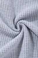 Open-Neck Textured Knit Polo in Gray - fabric texture close-up