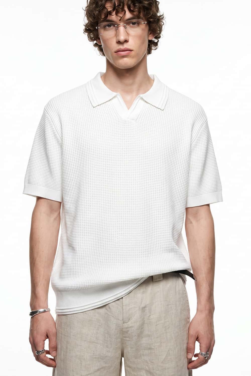 Open-Neck Textured Knit Polo in White - front modeled close-up