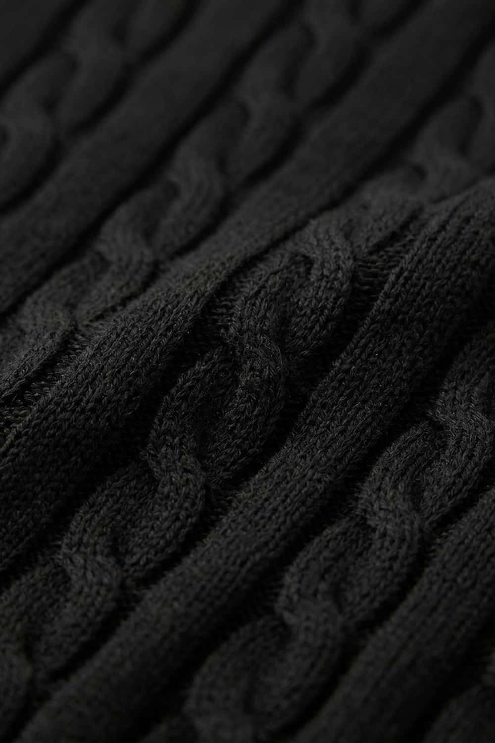 Cable-Knit Short-Sleeve Polo in Black - fabric texture close-up