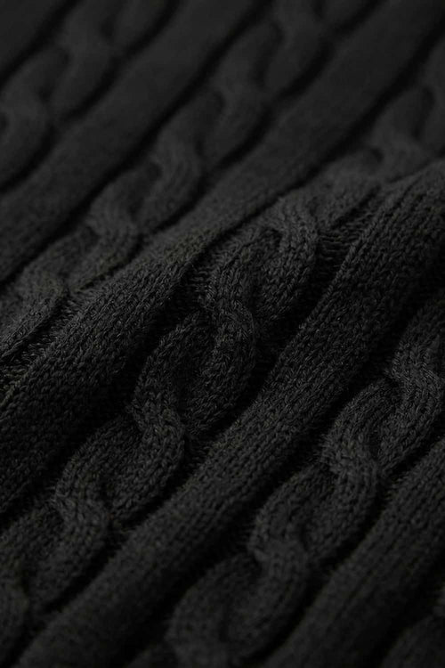 Cable-Knit Short-Sleeve Polo in Black - fabric texture close-up
