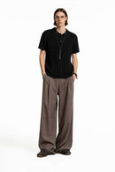 Cable-Knit Short-Sleeve Polo in Black - full-length front modeled view