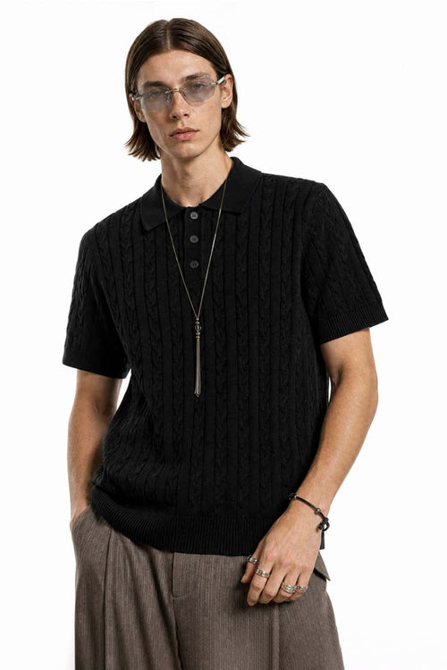 Cable-Knit Short-Sleeve Polo in Black - front modeled close-up
