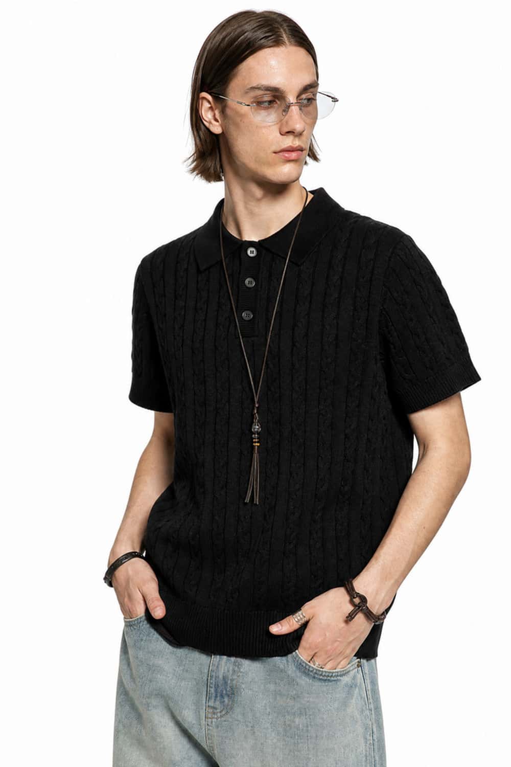 Cable-Knit Short-Sleeve Polo in Black - three-quarter front modeled view