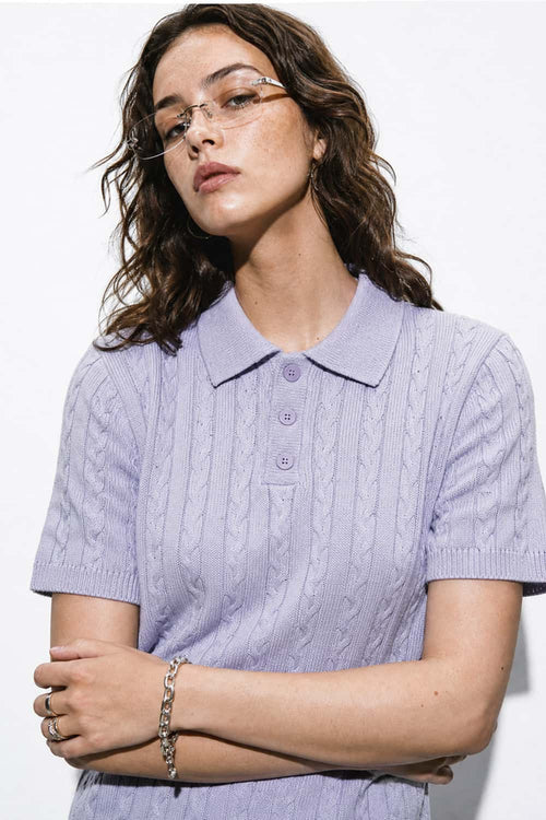Cable-Knit Short-Sleeve Polo in Blue - front modeled close-up