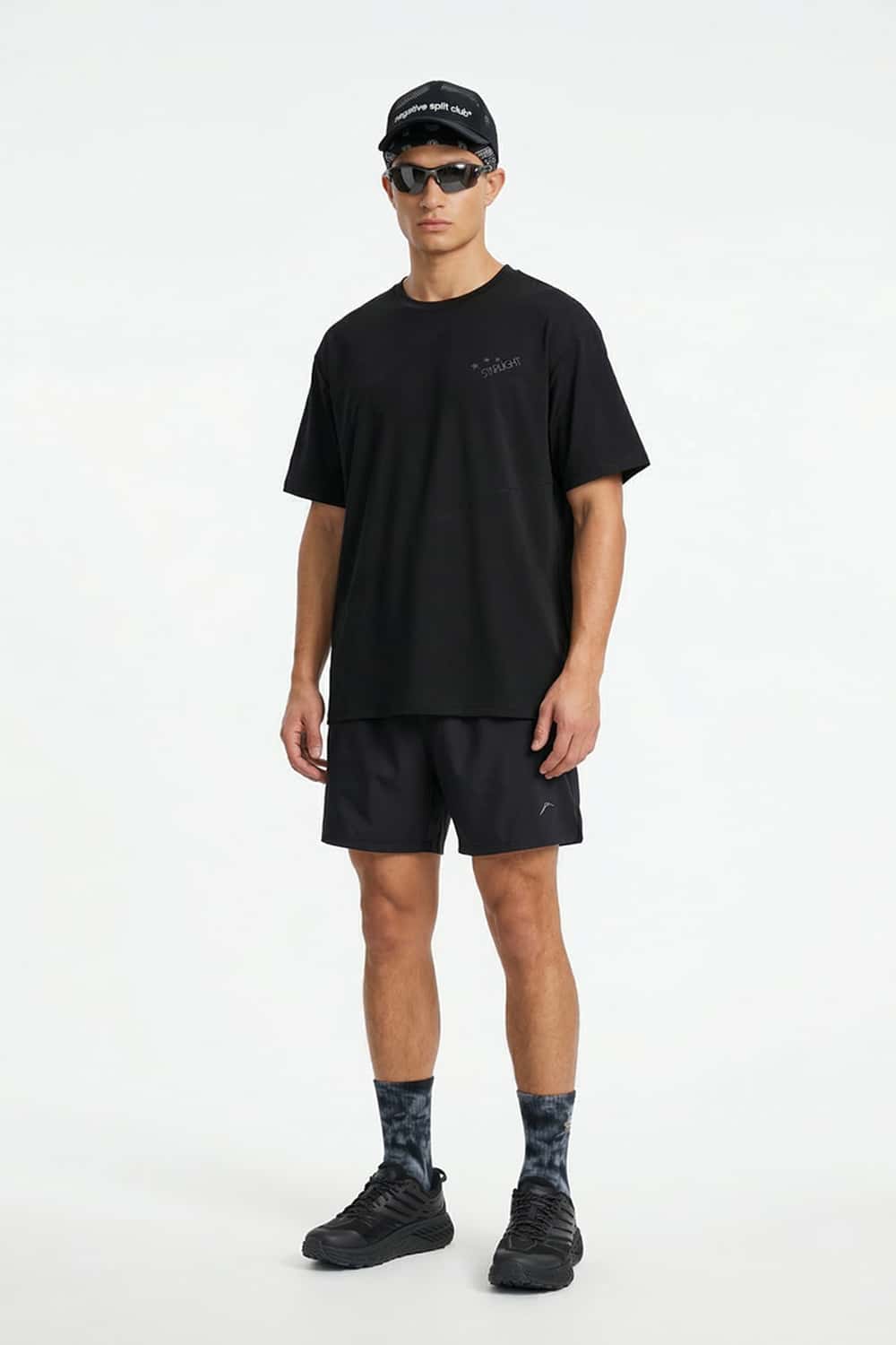 Reflective Star-Graphic Performance T-Shirt in Black - full-length front modeled view
