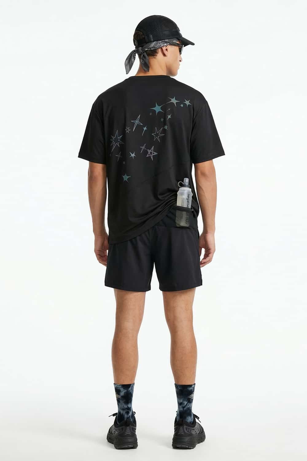 Reflective Star-Graphic Performance T-Shirt in Black - full-length back modeled view