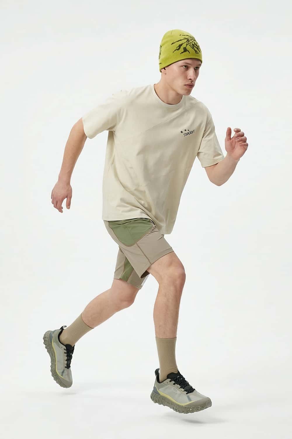 Reflective Star-Graphic Performance T-Shirt in Light Khaki - full-length front modeled view