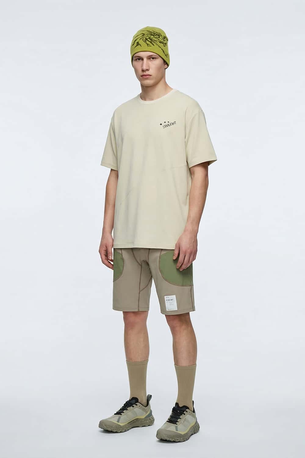 Reflective Star-Graphic Performance T-Shirt in Light Khaki - full-length front modeled view