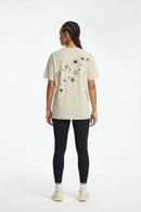Reflective Star-Graphic Performance T-Shirt in Light Khaki - full-length back modeled view