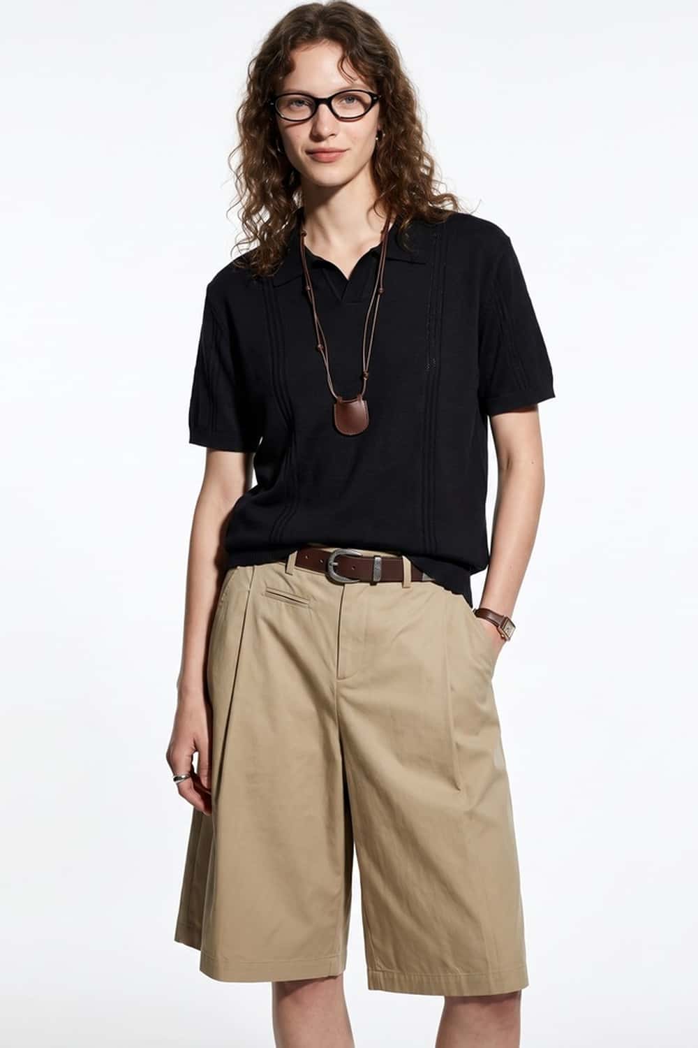 Open-Neck Knit Polo with Raised Stripes in Black - full-length front modeled view