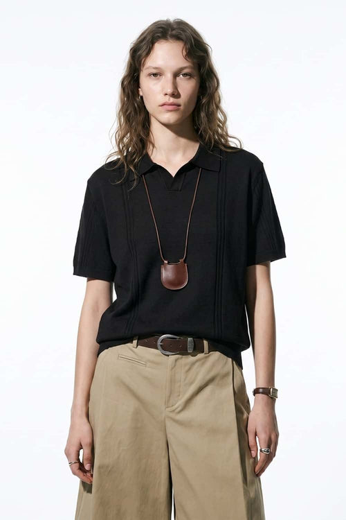 Open-Neck Knit Polo with Raised Stripes in Black - full-length front modeled view