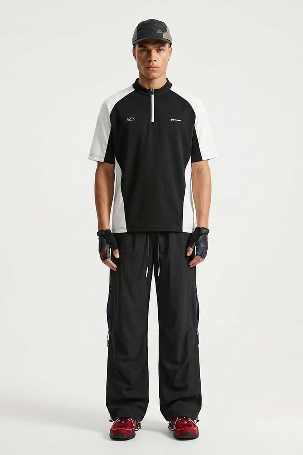 Waterproof Drawstring Trousers with Adjustable Hems in Black - full-length front modeled view
