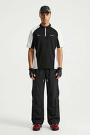 Waterproof Drawstring Trousers with Adjustable Hems in Black - full-length front modeled view
