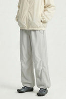 Waterproof Drawstring Trousers with Adjustable Hems in Khaki - front modeled view