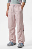 Waterproof Drawstring Trousers with Adjustable Hems in Light Pink - front modeled view