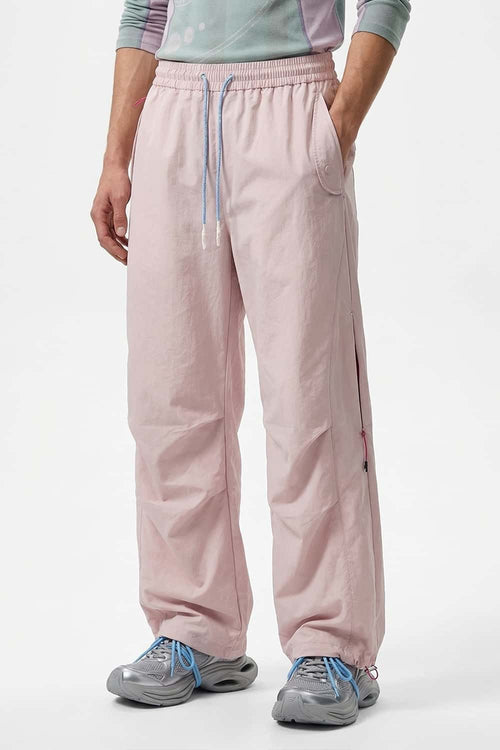 Waterproof Drawstring Trousers with Adjustable Hems in Light Pink - front modeled view