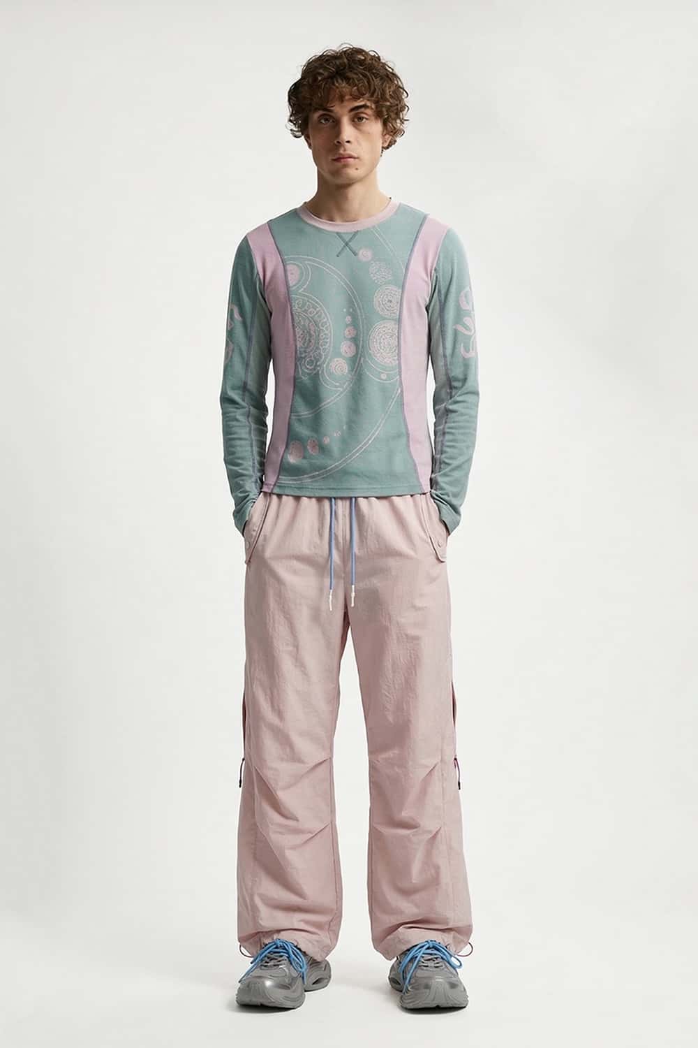 Waterproof Drawstring Trousers with Adjustable Hems in Light Pink - full-length front modeled view