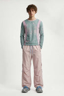 Waterproof Drawstring Trousers with Adjustable Hems in Light Pink - full-length front modeled view