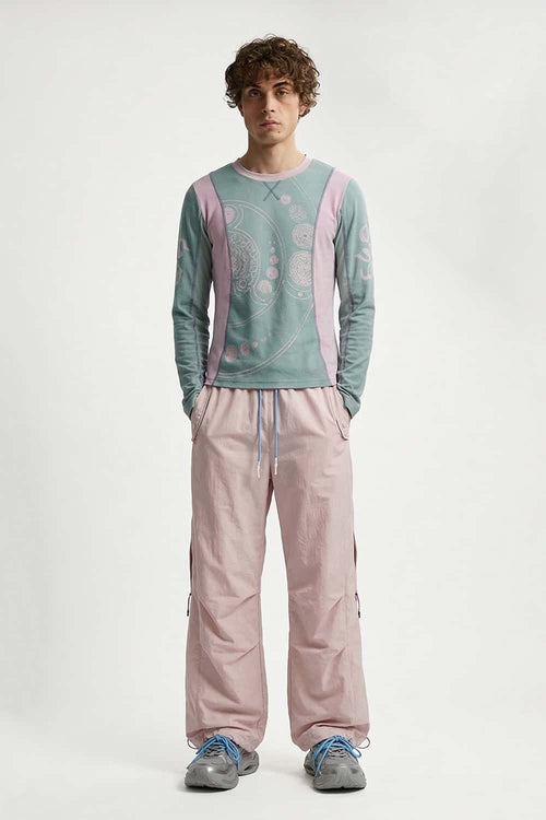 Waterproof Drawstring Trousers with Adjustable Hems in Light Pink - full-length front modeled view