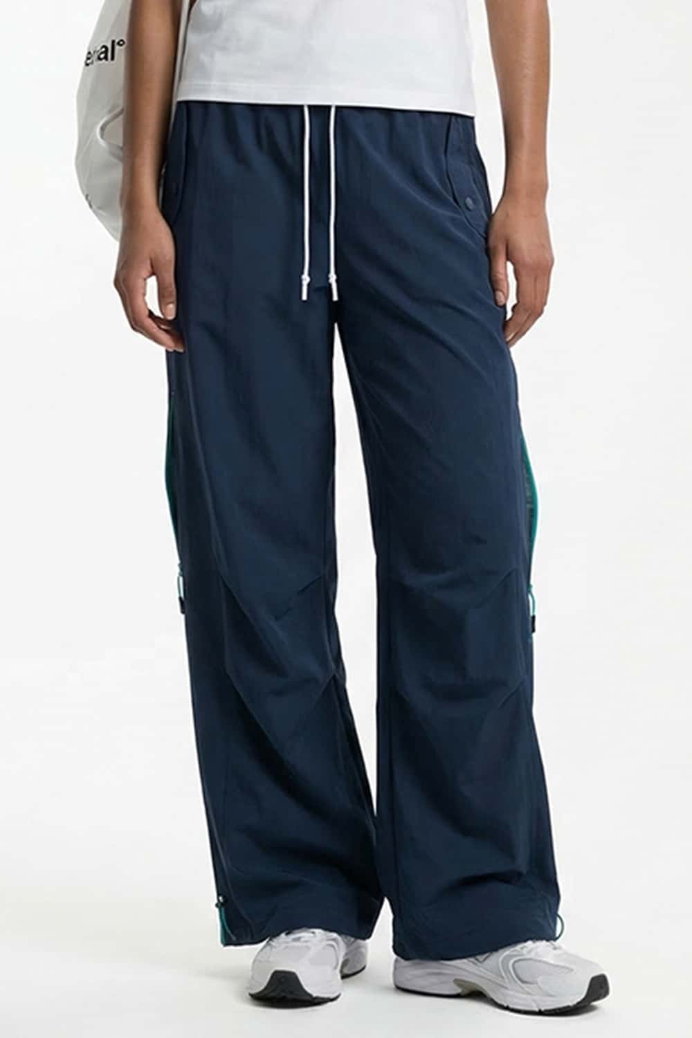 Waterproof Drawstring Trousers with Adjustable Hems in Navy Blue - front modeled view
