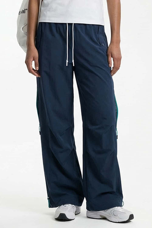 Waterproof Drawstring Trousers with Adjustable Hems in Navy Blue - front modeled view