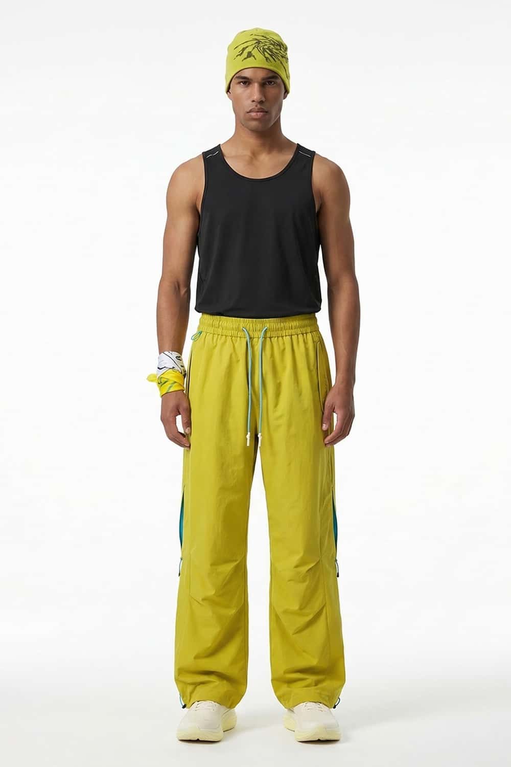 Waterproof Drawstring Trousers with Adjustable Hems in Yellow - full-length front modeled view